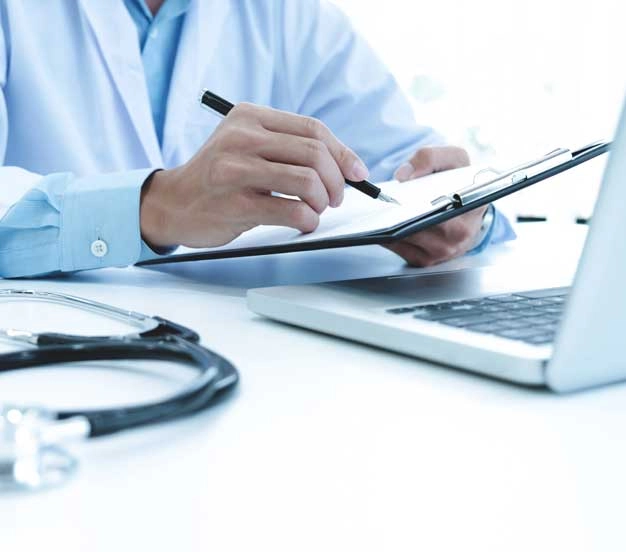 Medical professional performing a medical review to draft a medical narrative summary for legal counsel